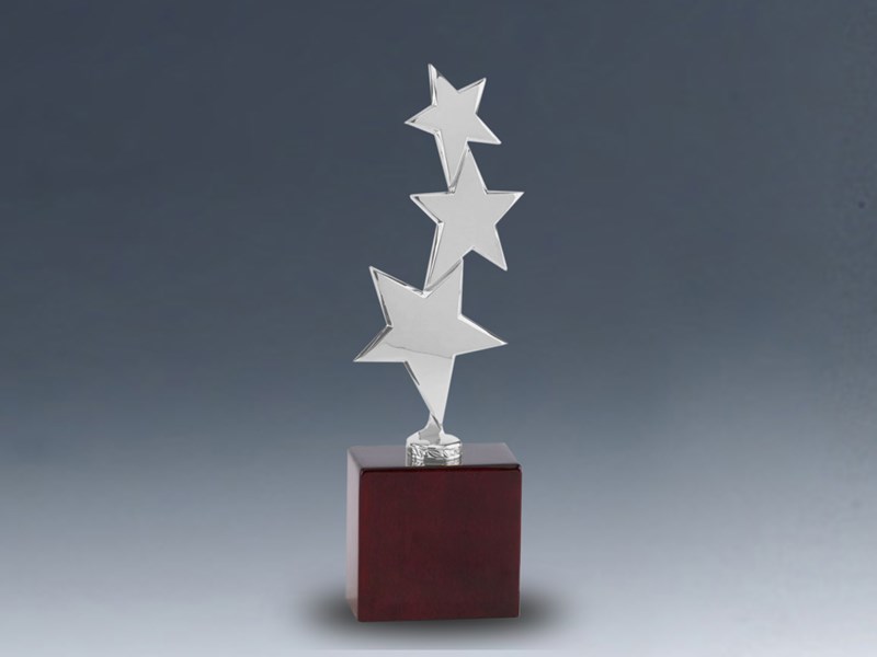 Three silver stars on wood base